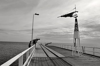 grey-sky-pier-water-light-post-royalty-free-thumbnail.jpg