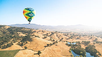 hot-air-balloon-blue-sky-lake-royalty-free-thumbnail.jpg
